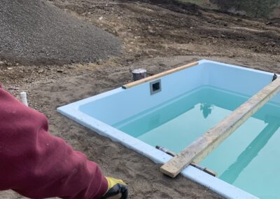 Filling in around an installed pool edge.